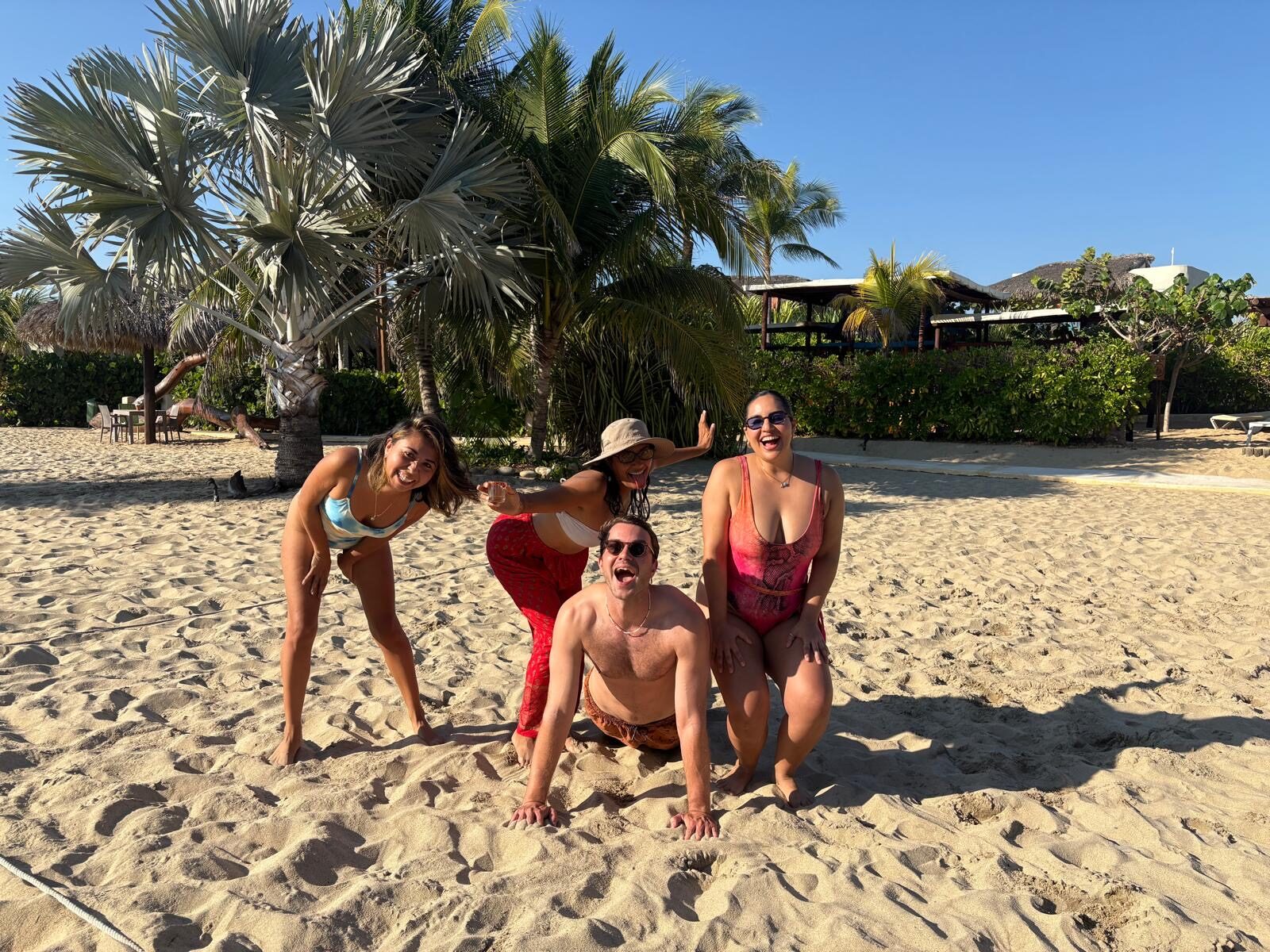 Friends laughing together on the beach in La Punta